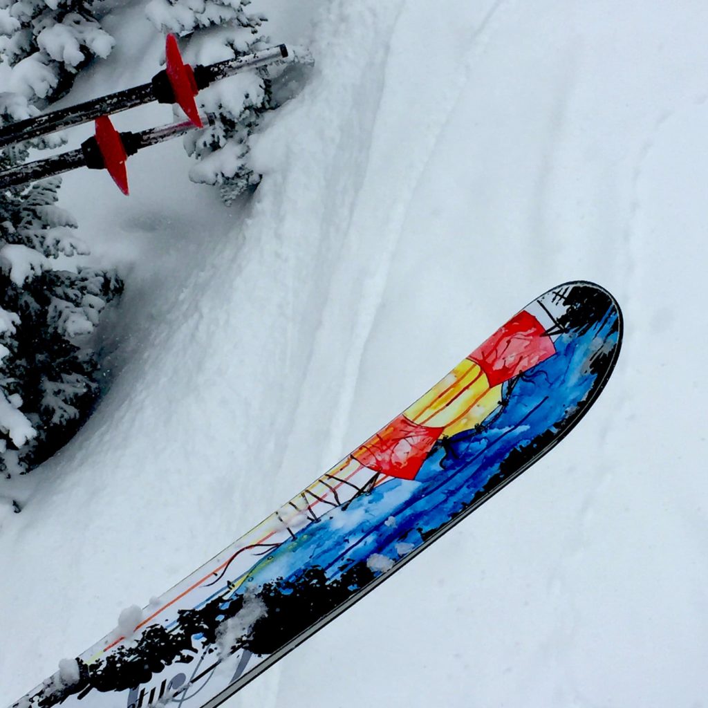 A skier with a State of Colorado ski at Mary Jane.