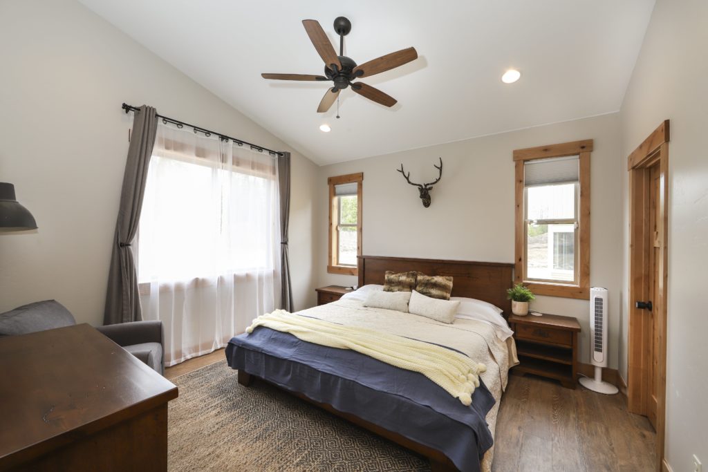 Comfy king bed in the master suite of this Winter Park area vacation rental.