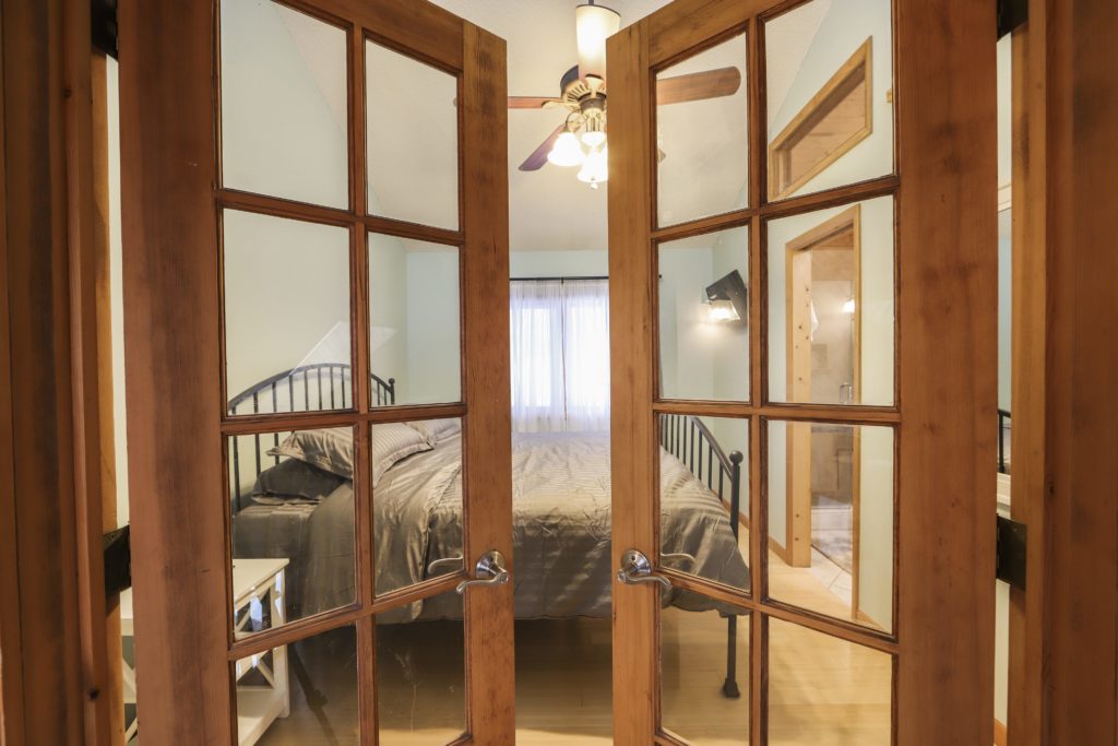 Master suite with full bathroom and smart tv.