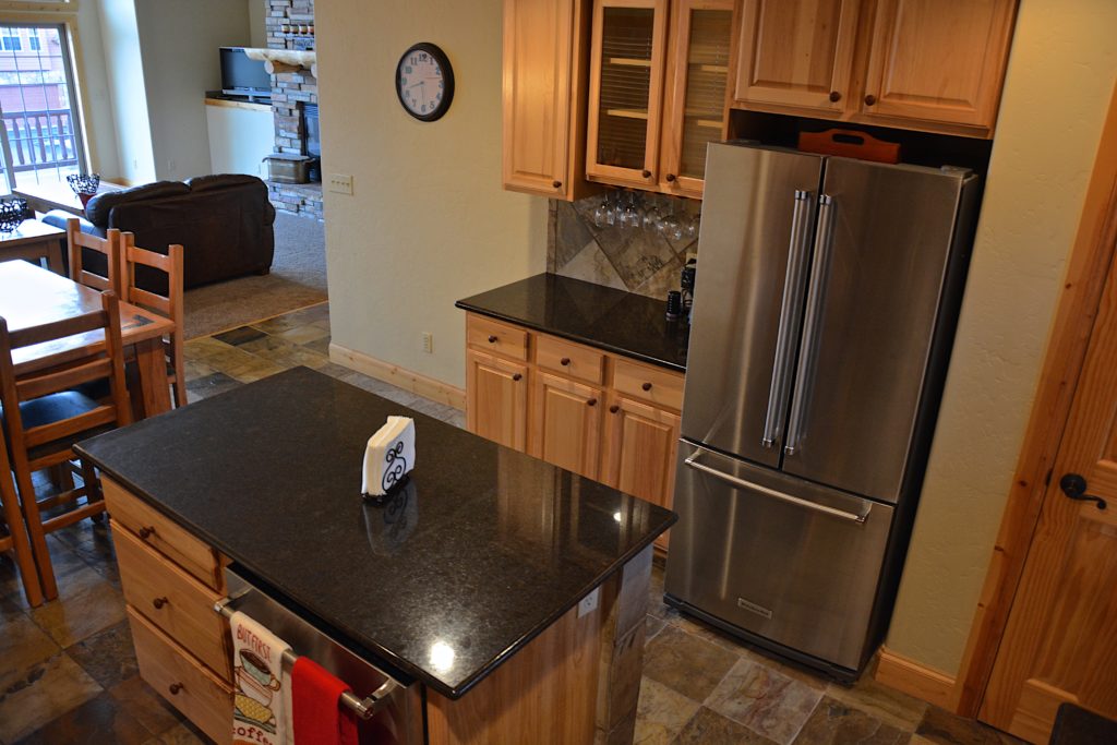 Granite counter tops in this fully equipped kitchen